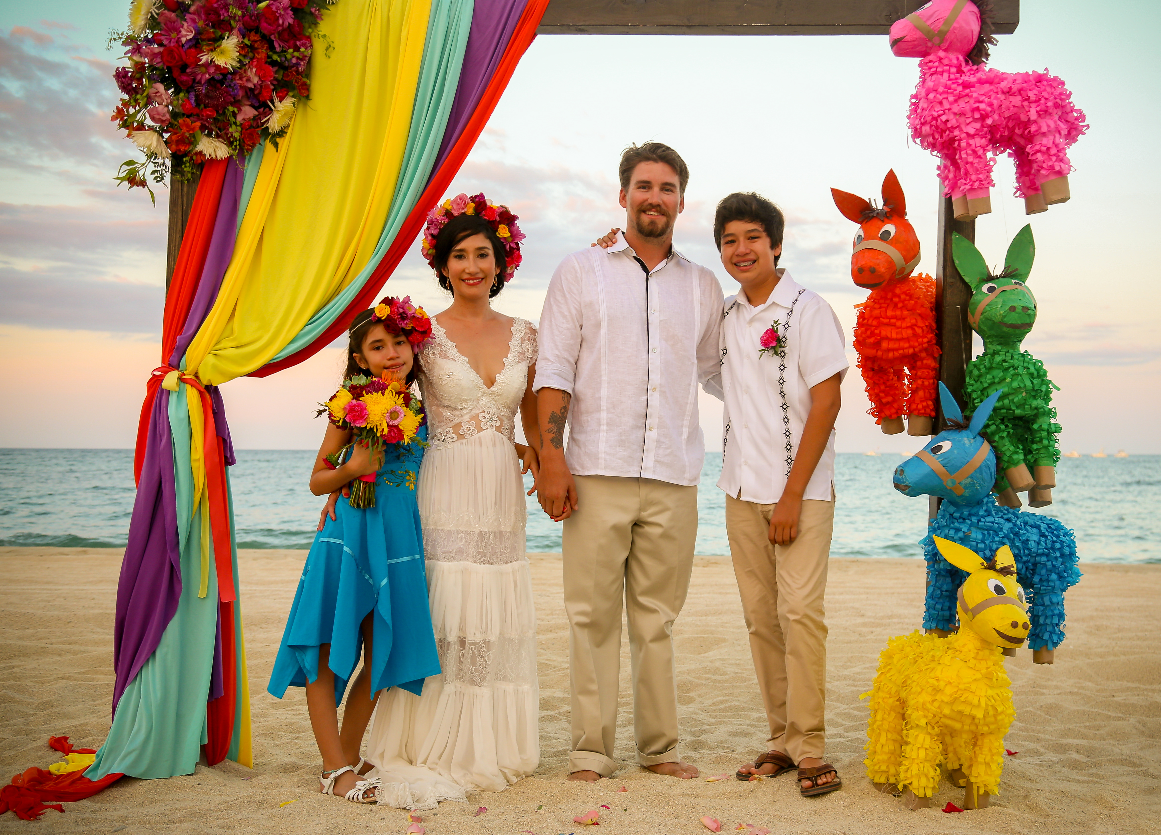 The four of us together at a beach celebration